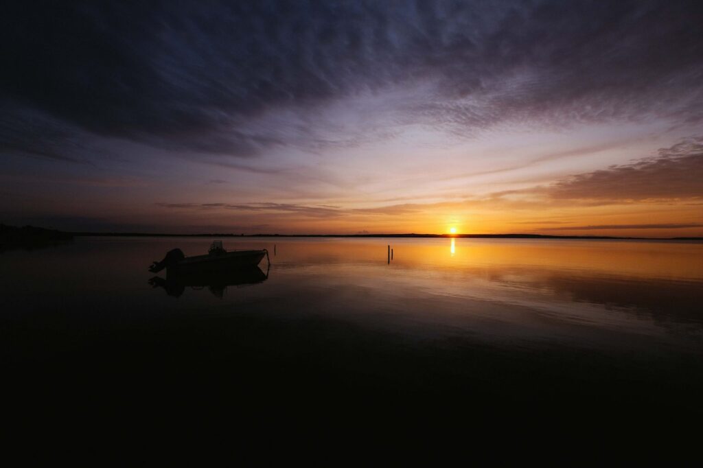 bass boat lake sunrise