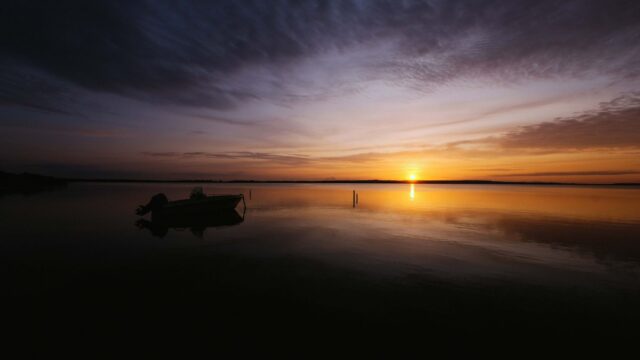 bass boat lake sunrise
